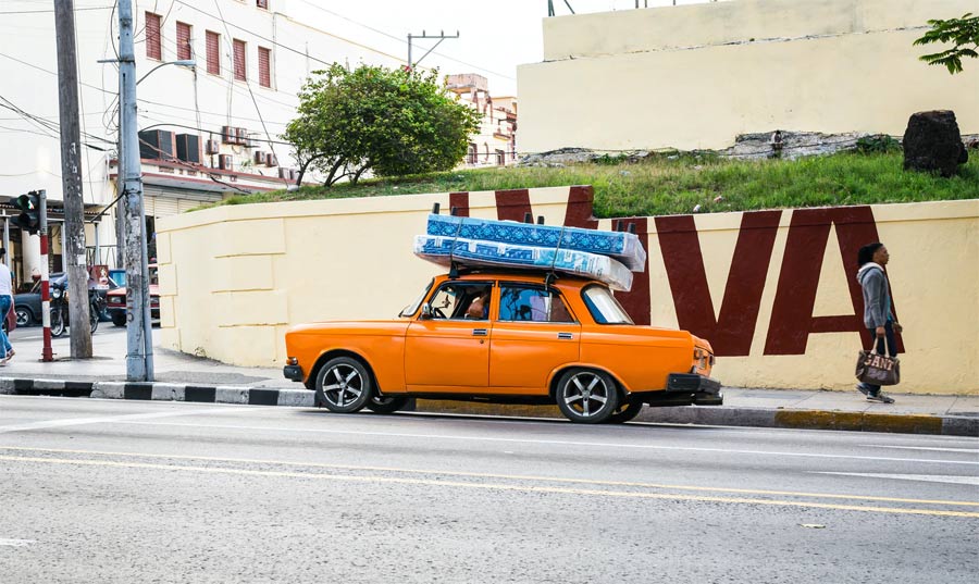 transporting mattress on top of car